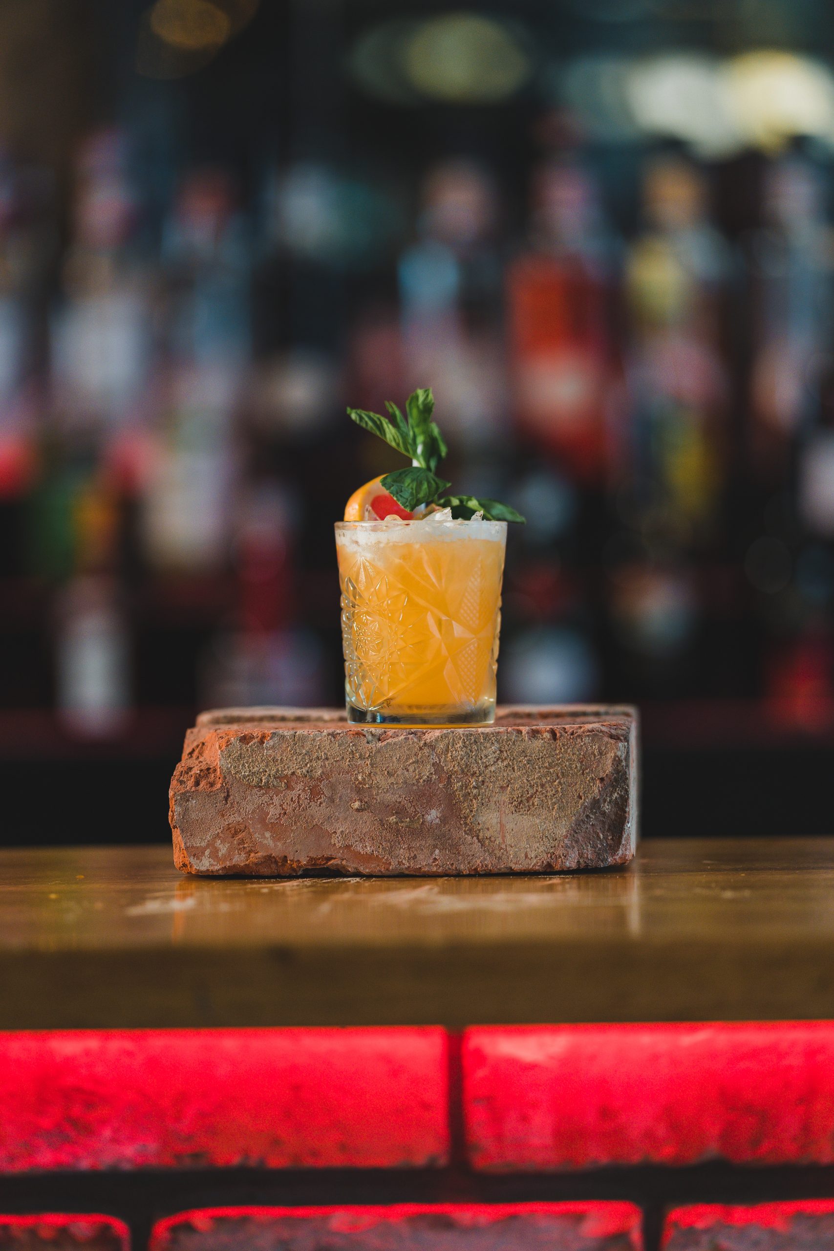 cocktail with fresh fruit garnish at The Firehouse