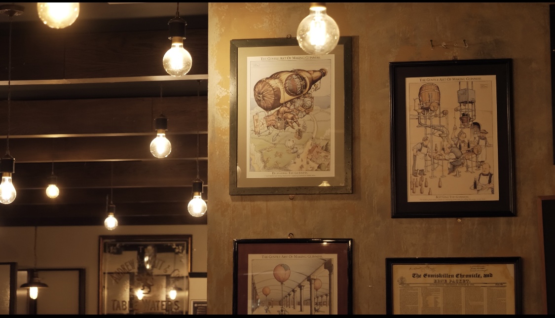 artwork and line drawings decorating the walls of the Crowes nest with exposure bulb pendants