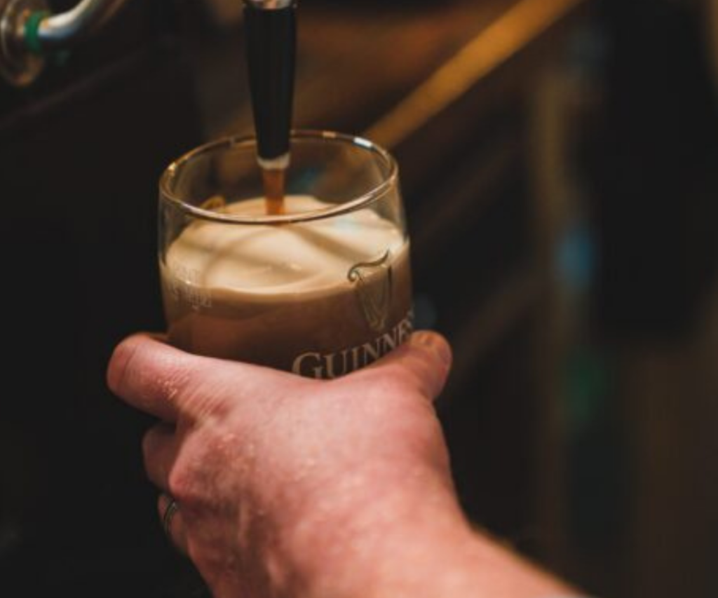 pulling pint of guinness