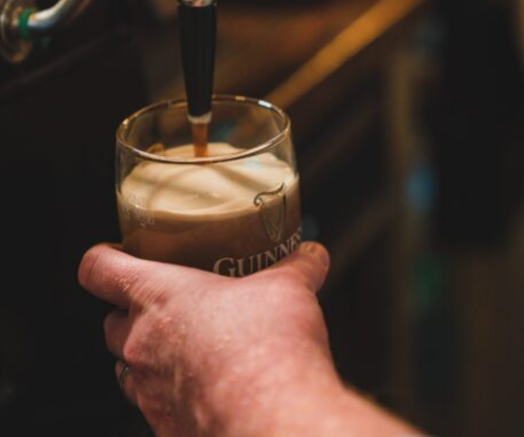 pulling pint of guinness